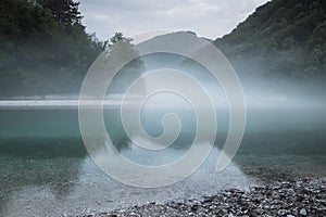 Misty confluence of Soca and Tolminka river in Slovenia