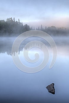 Misty Dawn on a Lake in Ontario, Canada