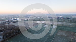 Misty Farmland Morning: Aerial View at Dawn