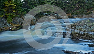 Misty flow of Big River near Flatrock, Newfoundland, Canada