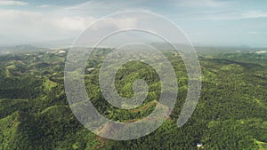 Misty green rainforest mounts aerial view at Legazpi, Philippines, Asia. Heavy rain cloudy sky