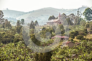 Uganda - misty landscape with church photo