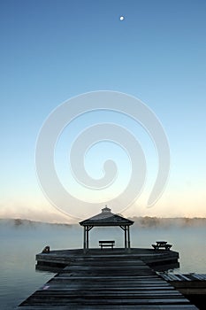 Misty morning at Lake Rosseau Pier with moon