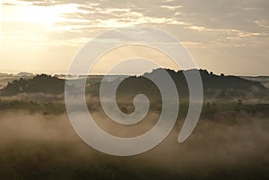 Misty morning in the mountains, Landscape view of Khao Na Nai Luang temple on peak mountain at Surat Thani Province, Southern of T