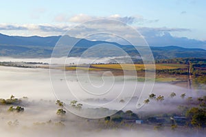 Misty morning over farmland