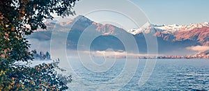 Misty morning panorama of Zell lake. Picturesque autumn view of Austrian Alps, with Grossglockner peak on background. Beauty of