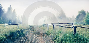 Misty morning scene of Carpathian mountains. Stunning summer countryside view with old road in mountain valley, Ukraine, Europe.