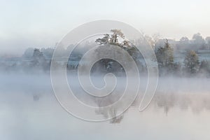 Misty morning at sunrise in autumn.