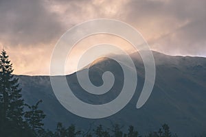 Misty morning view in wet mountain area in slovakian tatra - vintage film look