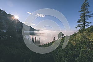 Misty morning view in wet mountain area in slovakian tatra - vintage film look