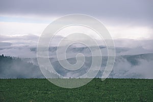 Misty morning view in wet mountain area in slovakian tatra - vintage film look