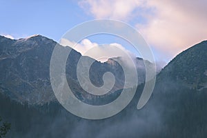 Misty morning view in wet mountain area in slovakian tatra - vintage film look