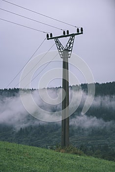 Misty morning view in wet mountain area in slovakian tatra - vintage film look