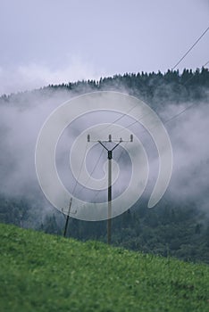 Misty morning view in wet mountain area in slovakian tatra - vintage film look