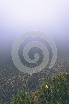 Misty morning view in wet mountain area in slovakian tatra - vintage film look