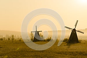 Misty morning view of the windmill on the prairie