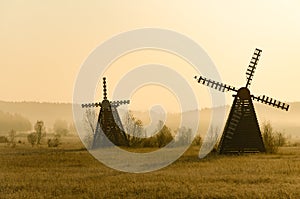 Misty morning view of the windmill on the prairie