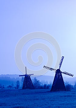 Misty morning view of the windmill on the prairie