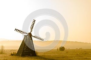 Misty morning view of the windmill on the prairie