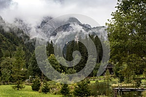 Misty mountain landscape with clouds