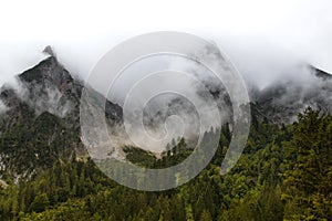 Misty mountain landscape with clouds