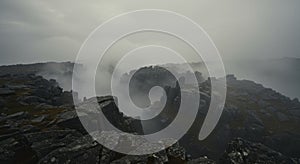 Misty Mountain Landscape with Dark Rocks