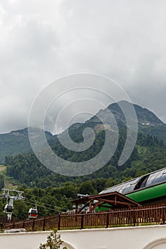 Misty mountain landscape with fir forest. Beautiful landscape with mountain view, cable car