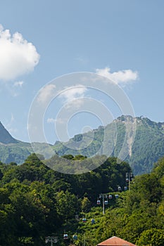 Misty mountain landscape with fir forest. Beautiful landscape with mountain view, cable car