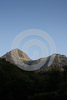 Misty mountain landscape with fir forest. Beautiful landscape with mountain view, cable car. Postcard view