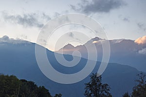 Misty mountain landscape with fir forest. Beautiful landscape with mountain view, cable car. Postcard view