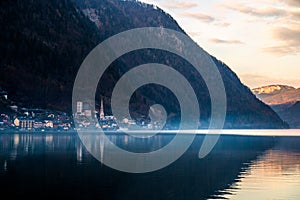 Misty mountains landscape with hills above old historic village of Hallstatt, HallstÃ¤tter Lake, Austria