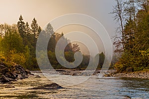 Misty river in the alps