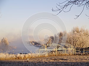 Misty river and greenhouse