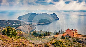 Misty spring view of Asos peninsula and town. Splendid morning seascape of Ionian Sea
