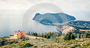 Misty spring view of Asos peninsula and town. Wonderful morning seascape of Ionian Sea. Amazing outdoor scene of Kephalonia island photo