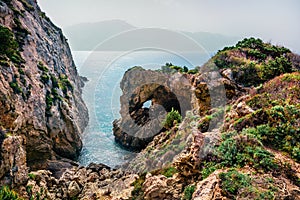 Misty spring view of Pirates Bay, Porto Timoni, Afionas village location. Great morning seascape of Ionian Sea. Colorful outdoor