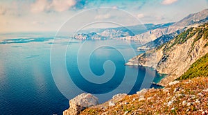 Misty summer view of Asos peninsula and town. Aerial morning seascape of Ionian Sea. Breathtaking outdoor scene of Kephalonia isla