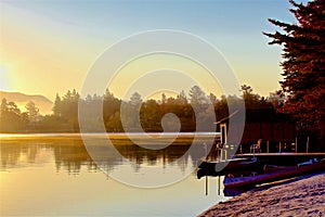 Misty sunrise morning Mirror Lake Lake Placid NY