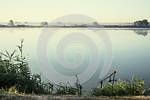 Misty sunrise over a lake summer morning