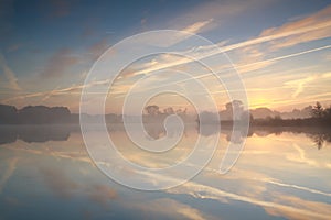 Misty sunrise over river