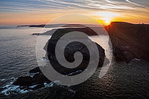 Misty sunrise over the rocky coast of Kilkee, Co. Clare. Ireland