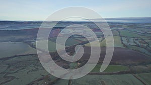 Misty Sunrise over Wetlands and meadows in RSPB Exminster and Powderham Marshe from a drone
