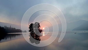 Misty sunset over scottish loch