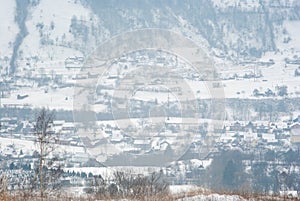 Misty winter morning in mountain village