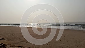 A misty winter morning sunrise at the beach