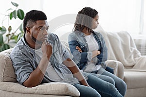 Misunderstanding In Relationship. Young black couple ignoring each other after conflict