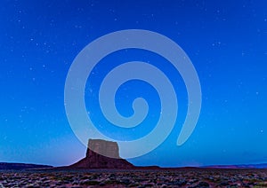 Mitchell Butte at Monument Valley with milky way above.