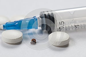 Mite, tablets and syringe