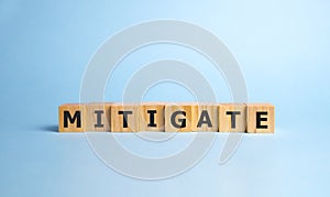 MITIGATE word made with building blocks, business concept photo