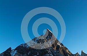 Mitre peak in Karakoram range at sunset view from Concordia camp, K2 trek, Pakistan, Asia